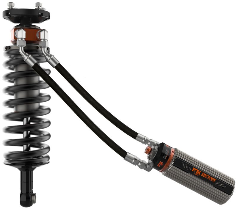 Featuring a sleek design with black and orange accents, the FOX 2022+ Toyota Tundra 3.0 Factory Race Series Internal Bypass Front Shock for a 2.0-2.25in lift w/UCA comes with internal bypass technology and two hoses connecting to a cylindrical reservoir as part of the FOX ride zone series.