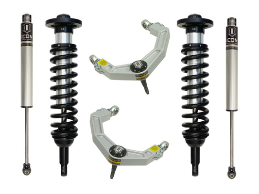 A suspension kit branded as ICON, designed for the 04-08 Ford F-150 2WD with a lift range of 0-2.63 inches, showcases a pair of shock absorbers with coil springs and billet upper control arms featuring Delta Joint technology. These components are arranged symmetrically on a white background and exhibit black and metallic finishes adorned with the ICON logo, ensuring enhanced corrosion resistance for enduring performance.