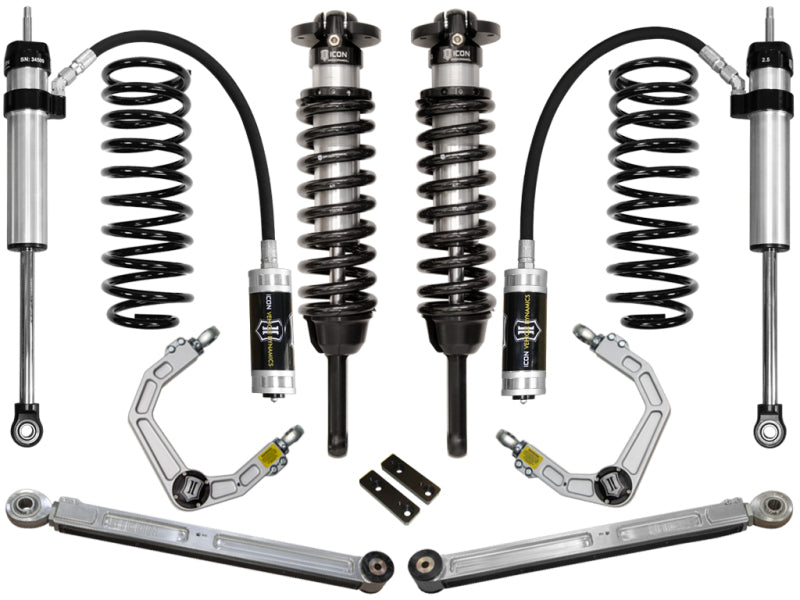 A selection of vehicle suspension components, comprising coilovers, shock absorbers, upper control arms with the cutting-edge Delta Joint technology, and additional parts from the ICON 03-09 Toyota 4Runner/FJ 0-3.5in Stage 4 Suspension System with Billet UCA are symmetrically displayed on a white background. These silver and black components proudly display ICON branding and offer advanced corrosion resistance.