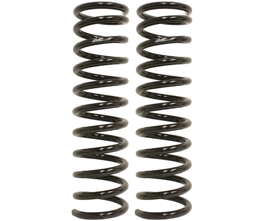 Two identical Carli Suspension 13-23 RAM 2500/3500 (4WD) Diesel 2.5" Lift Front Linear Rate Coil Springs in black stand upright side by side against a plain white background. These springs, specifically designed for Ram 2500/3500 trucks with a 2.5" lift, feature a shiny finish and symmetrical coils.