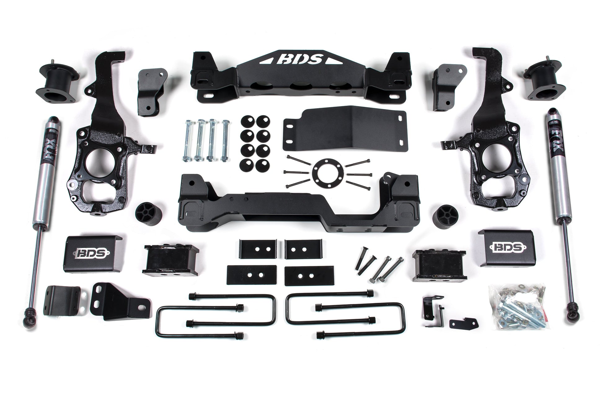 The BDS 4 Inch Lift Kit for the 2021-2023 Ford F150 4WD includes a comprehensive collection of off-road vehicle suspension components such as shock absorbers, control arms, brackets, bolts, spacers, and hardware. The meticulously arranged parts are set against a pristine white background with clear "BDS" branding on several components—ideal for enthusiasts seeking top-tier offroad protection.