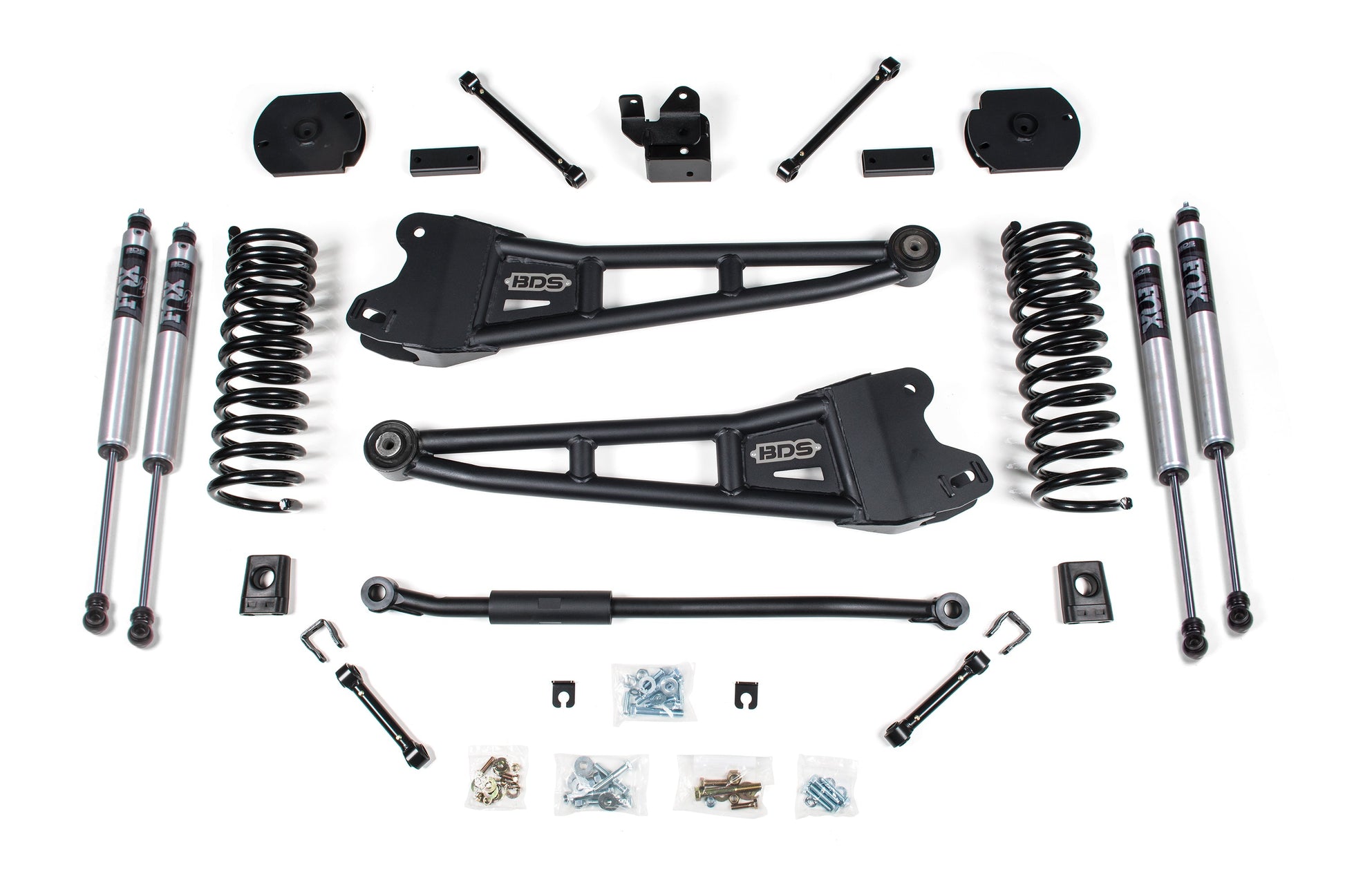 A kit containing various automotive suspension components, including FOX 2.0 nitrogen-charged shocks, diesel-specific Pro-Ride coil springs, control arms, and other hardware parts arranged neatly on a white background. These components appear to be part of the BDS 3 Inch Lift Kit W/ Radius Arm for the Ram 2500 (14-18) 4WD | Diesel.