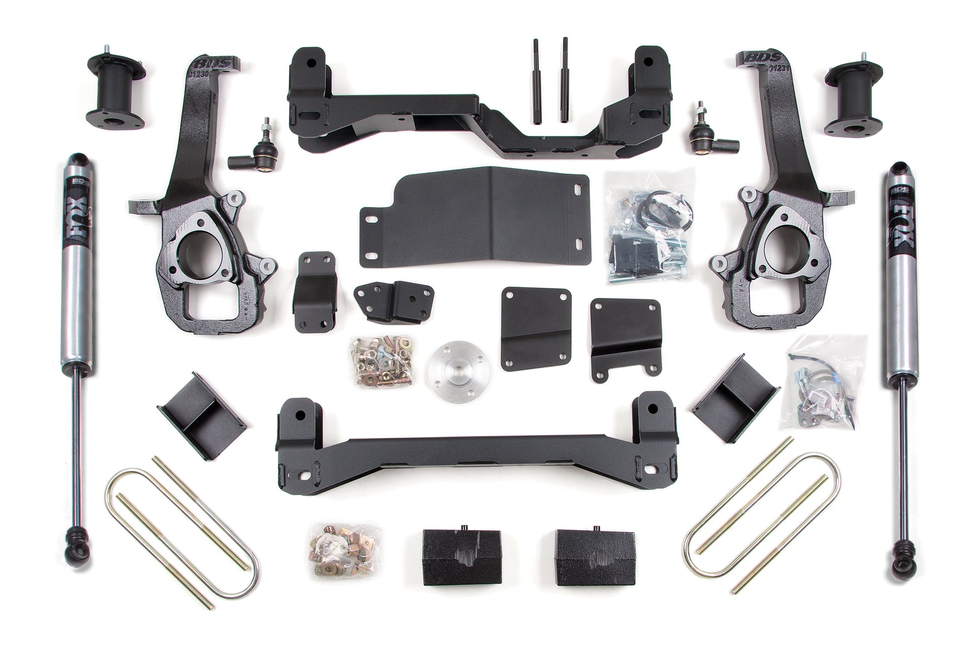 A comprehensive 6 Inch Lift Kit by BDS for the Dodge Ram 1500 (06-08) 4WD, including shock absorbers, brackets, bolts, spacers, and various hardware parts, arranged neatly on a white background. The kit is perfect for off-road protection and modifying the suspension system to accommodate 37" tires.