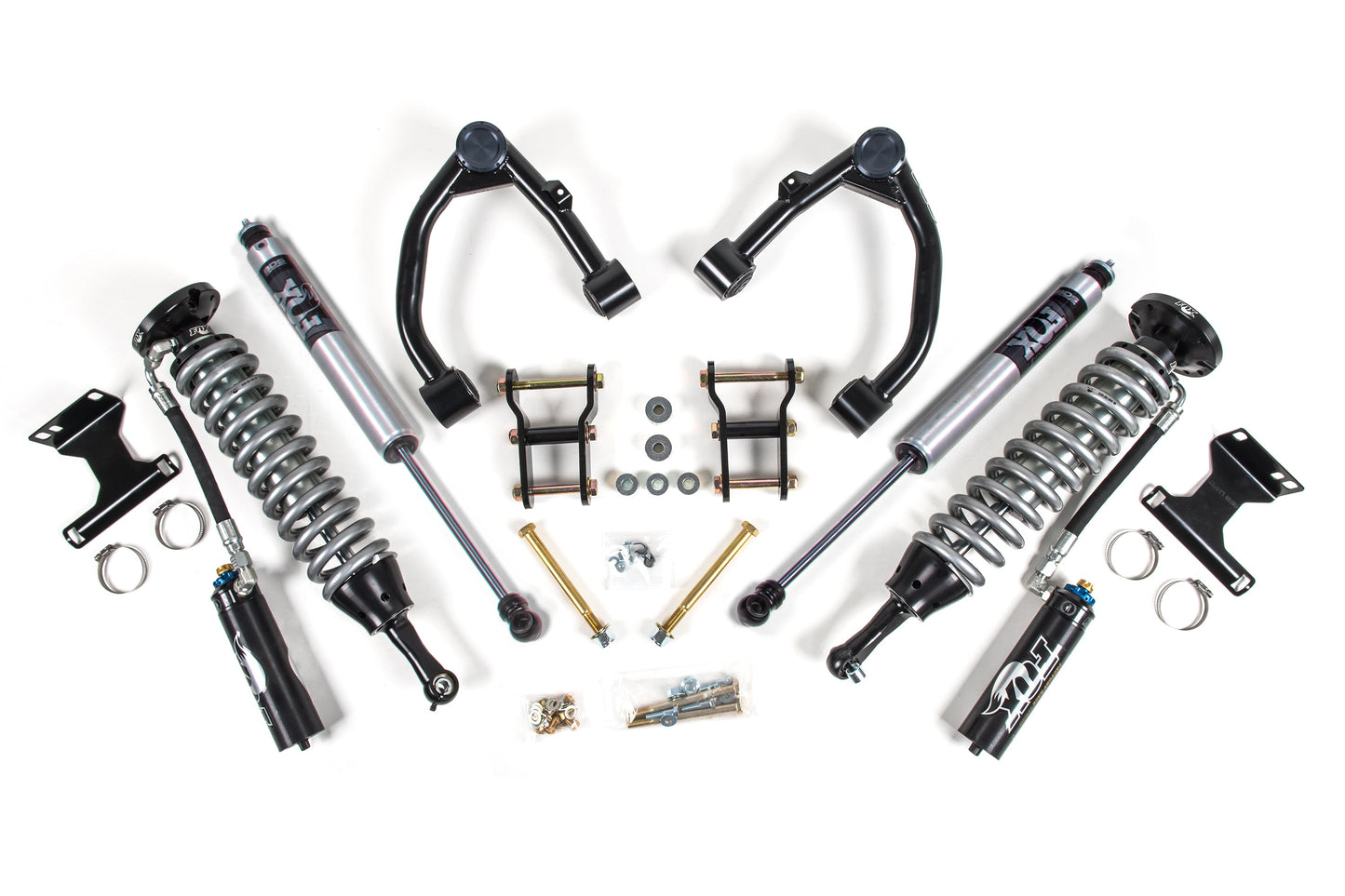 A set of automotive suspension components, including FOX 2.5 coil-over shocks, coil springs, control arms, bolts, and other hardware from the BDS 3 Inch Lift Kit for Toyota Tundra (07-21) 2/4WD arranged symmetrically on a white background. The parts appear to be new and are designed for vehicle suspension enhancement.
