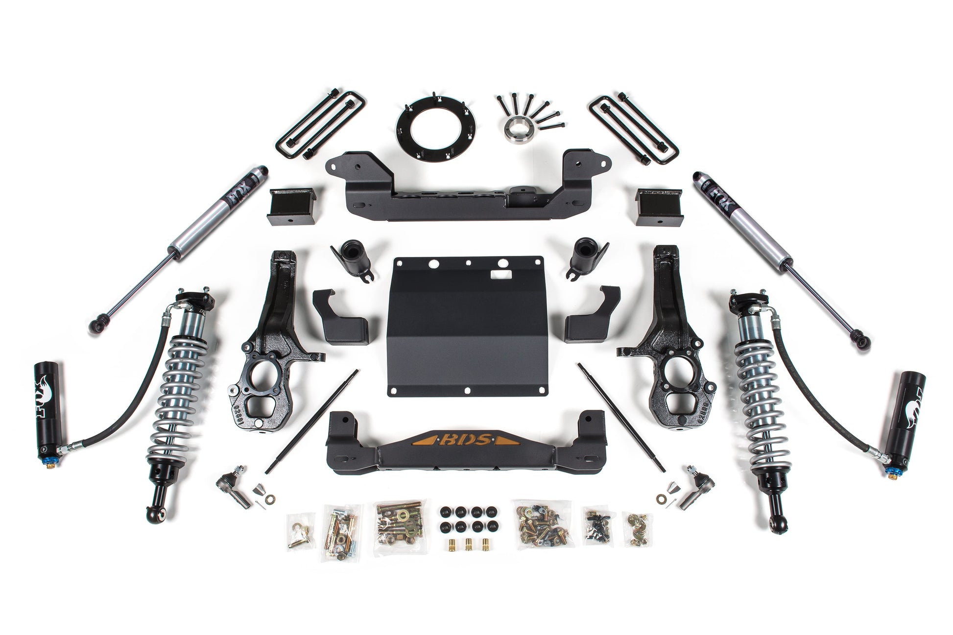 A BDS 5.5 Inch Lift Kit for the Chevy Colorado or GMC Canyon (15-22) 4WD, featuring FOX 2.5 Coil-over shocks, braces, mounting brackets, bolts, and spacers arranged in a symmetrical pattern on a white background.