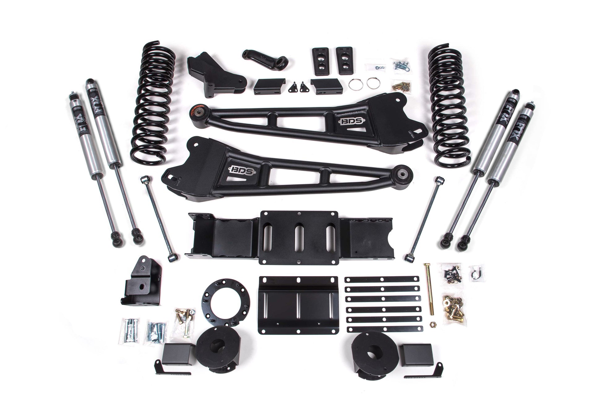 A comprehensive BDS 4 Inch Lift Kit with Radius Arm for a 2019-2024 RAM 2500 with Rear Air Ride and Gas engine is displayed. The kit includes black control arms, coil springs, shock absorbers, brackets, bolts, and various mounting hardware, all meticulously arranged on a white background for a clear view of each component.