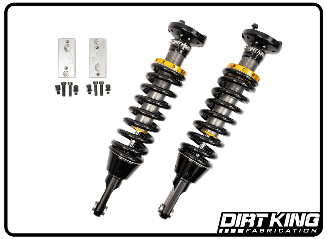 Two Dirt King 03-23 Toyota 4Runner 2.0 IFP Coilovers in black and yellow, engineered to enhance ride quality, are presented on a white background complete with mounting brackets and screws. The elegantly placed Dirt King Fabrication logo graces the bottom right corner, highlighting these premium coilovers from DIRT KING SHOCKS.