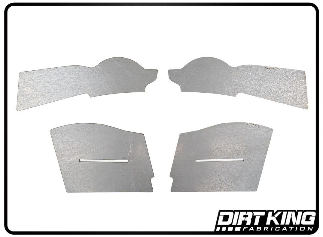 Four metallic cutout pieces of varying shapes and sizes are displayed against a white background. The pieces, part of the 05-23 Toyota Tacoma Front Frame Plate Kit by DIRT KING, have different geometric contours and appear symmetrical in pairs. The lower right corner features the DIRT KING Fabrication logo.