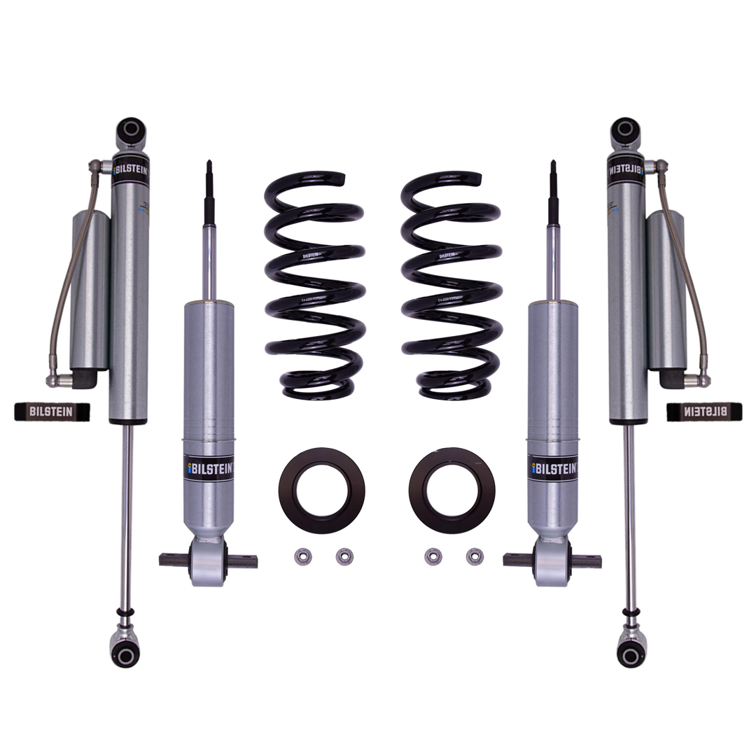 LTW Motorsports' 07-13 GM 1500 Leveling Kit features two Bilstein 6112 struts, rear 5160 shocks, and additional mounting components. The brand-labeled shocks are perfectly paired and arranged on a white background, offering a sleek setup with precisely matching rear shocks.