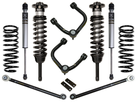 Photograph showcasing the ICON 03-09 Toyota 4Runner/FJ 0-3.5in Stage 3 Suspension System with Tubular UCA by ICON. The kit includes two shock absorbers paired with coil springs, two extra coil springs, and tubular upper control arms, all designed for enhanced corrosion resistance. These components are elegantly arranged symmetrically on a white background for a refined presentation.