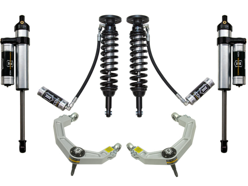 Image showcasing the ICON 09-13 Ford F-150 2WD 1.75-2.63in Stage 3 Suspension System w/Billet UCA by ICON, featuring corrosion-resistant upper control arms with integrated ball joints. The setup includes two shock absorbers with coils, additional shocks equipped with cylindrical reservoirs and hoses, and the Delta Joint for enhanced durability—all set against a pristine white background.