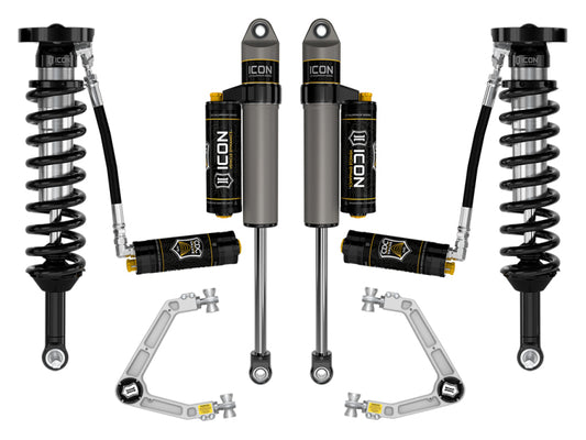 The ICON 2023 Chevrolet Colorado Stage 5 Suspension System includes four coil-over shocks with reservoirs, two Delta Joint PRO billet UCAs, and metal connectors. All components featuring the "ICON" logo are symmetrically displayed on a white background.