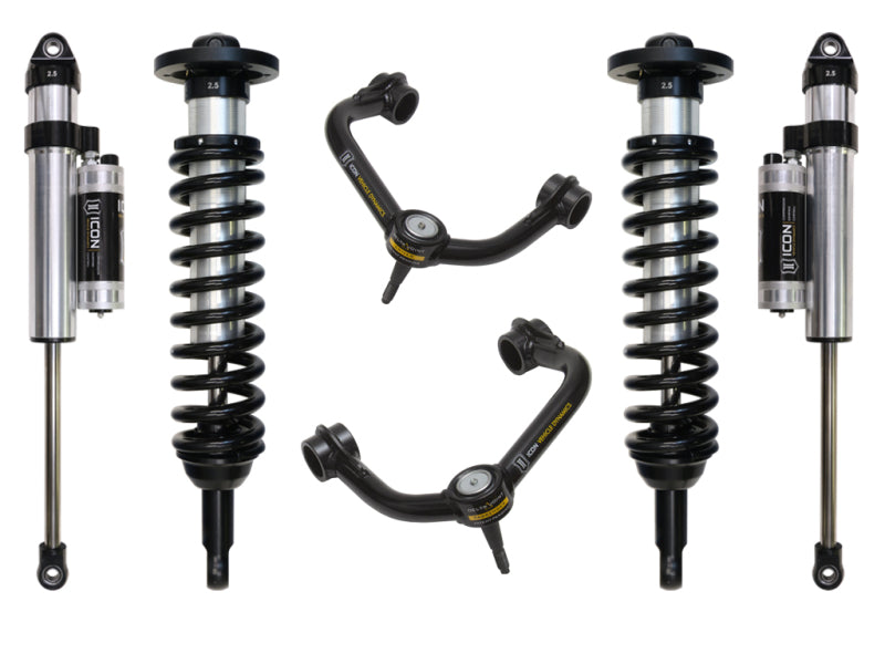 Image of the ICON 04-08 Ford F-150 4WD 0-2.63in Stage 4 Suspension System with Tubular Upper Control Arms by ICON, featuring four coilover shock absorbers with reservoirs and two corrosion-resistant black upper control arms. The setup includes a Delta Joint for enhanced durability, all symmetrically arranged on a white background.