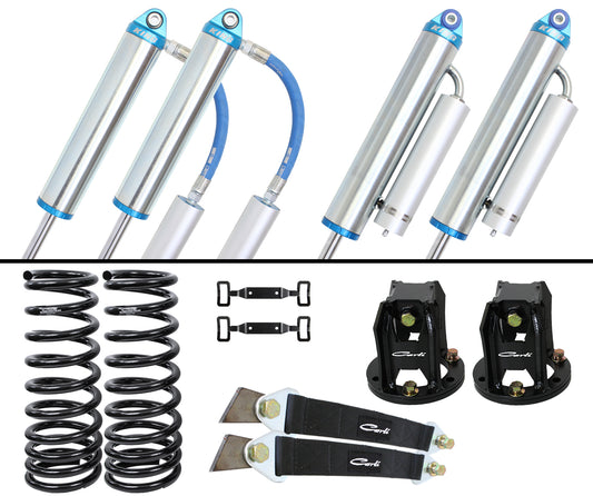 Product image showcasing the Carli Suspension 94-02 Dodge RAM 2500/3500 (4WD) Diesel 2.75" Lift Dominator System, including four shock absorbers highlighted with blue accents, two black coil springs, two black mounting brackets, and two black straps featuring metal ends, all beautifully arranged on a white background.