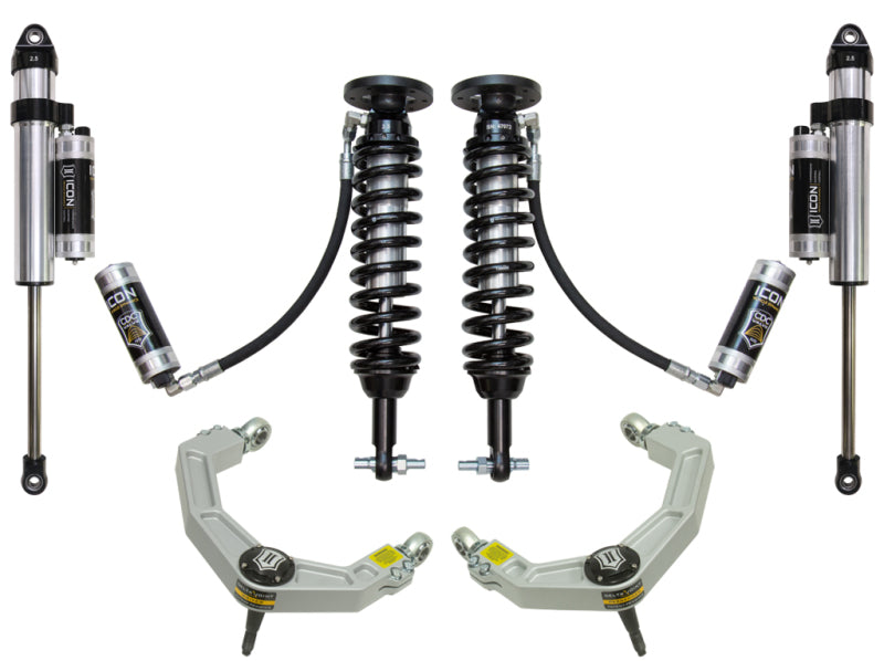 ICON suspension components for the 2015+ Ford F-150 2WD, expertly arranged on a white background, showcasing two coilover shock absorbers, two bypass shocks, and two billet upper control arms enhanced with Delta Joint technology for superior corrosion resistance. Each part proudly displays the ICON brand name.