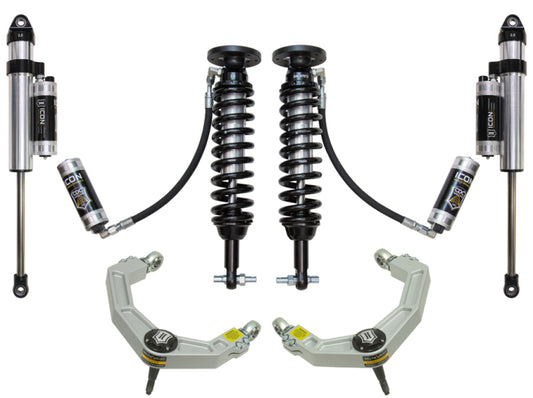 ICON suspension components for the 2015+ Ford F-150 2WD, expertly arranged on a white background, showcasing two coilover shock absorbers, two bypass shocks, and two billet upper control arms enhanced with Delta Joint technology for superior corrosion resistance. Each part proudly displays the ICON brand name.