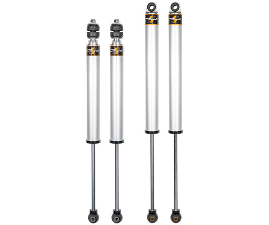 Four silver automotive shock absorbers from the Carli Suspension 05-23 Ford F-250/F-350 (4WD) CARLI-SPEC 2.0" IFP 4.5"/5.5" Lift Shock Set are displayed in pairs on a white background. Designed for a 4.5/5.5” lift Ford F250/F350, they feature black and gold details, with metal rods protruding from the bottom and connection points at the top.