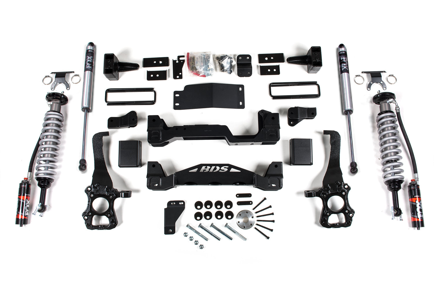 The image displays a complete set of automotive suspension components from BDS, specifically the 6 Inch Lift Kit for Ford F150 (2015-2020) 4WD. Included in the set are FOX 2.5 Performance Elite coil-over shocks, springs, control arms, mounting hardware, and other related components. All items are arranged neatly on a white background and designed for suspension lift kits.