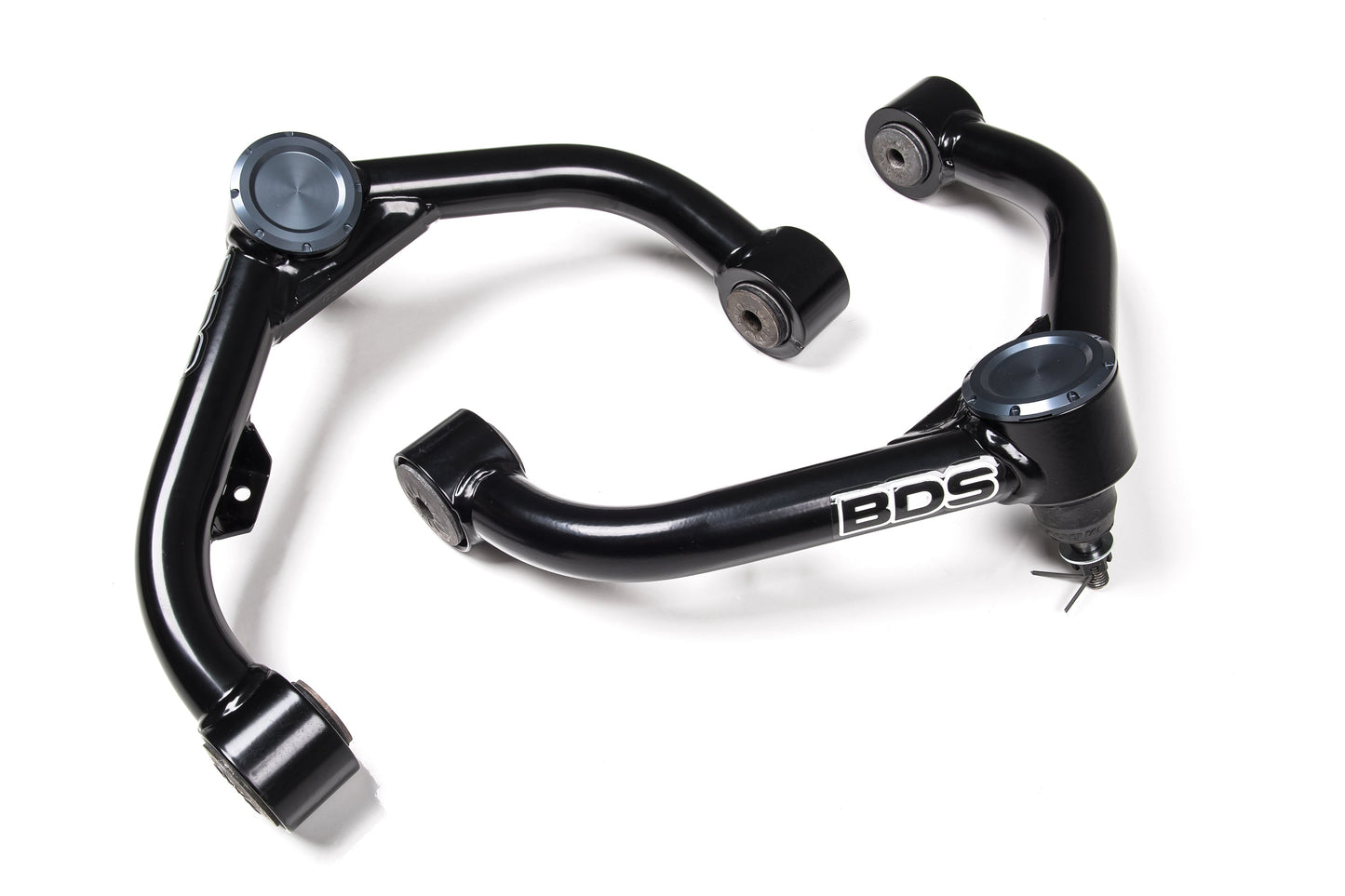 A pair of black, metal control arms for a vehicle, featuring the "BDS Performance UCA" logo on one arm. These Chevy Silverado and GMC Sierra 2500HD / 3500HD (01-10) upper control arms by BDS are glossy and appear brand new, with bushings at each attachment point. They are displayed against a white background.