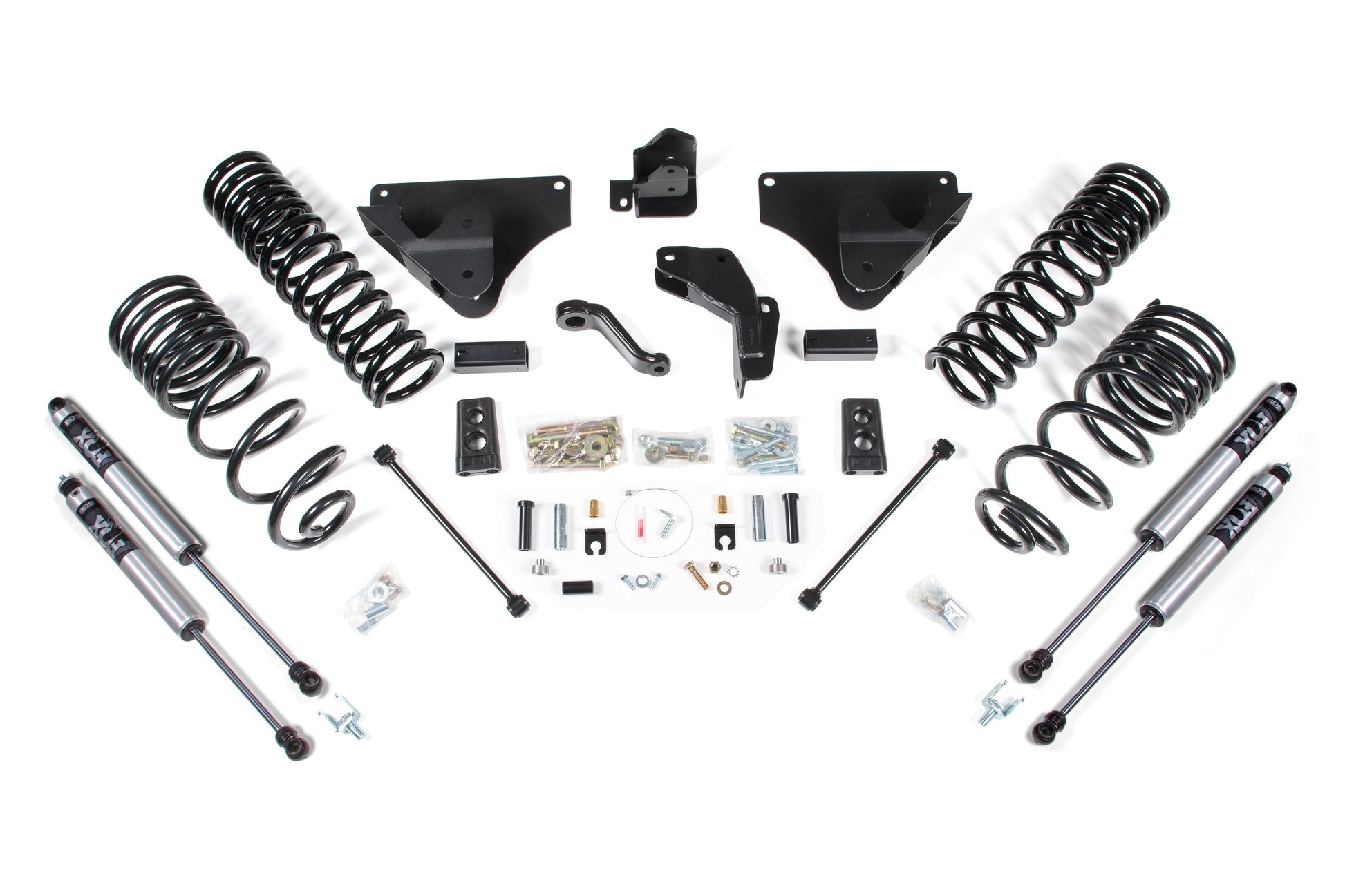 A collection of vehicle suspension components, including BDS Suspension Pro-Ride coil springs, shock absorbers, brackets, hardware, and various mounting pieces for a BDS 4 Inch Lift Kit designed for the 2014-2018 Ram 2500 Diesel 4WD, arranged symmetrically on a white background.