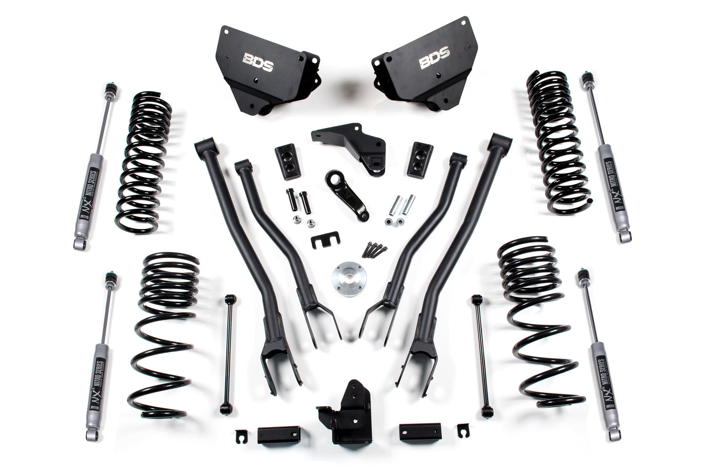 A neatly arranged flat-lay photo of a BDS 4 Inch Lift Kit W/ 4-Link for a RAM 2500 (2014-2018) Diesel 4WD, featuring various components such as coil springs, shock absorbers, control arms, brackets, bolts, and other mounting hardware on a white background.