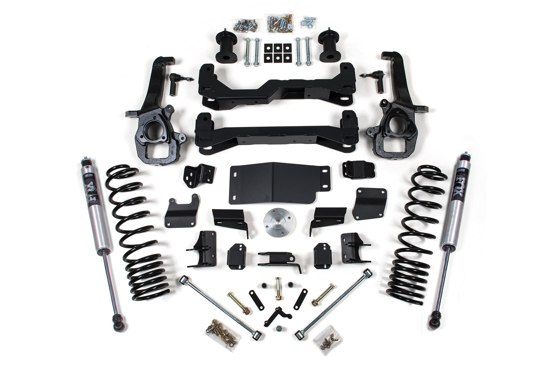 A 4 Inch Lift Kit built specifically for the RAM 1500 Rebel (models from 2019 to 2023) by BDS is neatly arranged on a white background. The kit features an assortment of vehicle suspension components, including shock absorbers, coil springs, brackets, bolts, and various small hardware items, all in sleek black and metallic finishes.