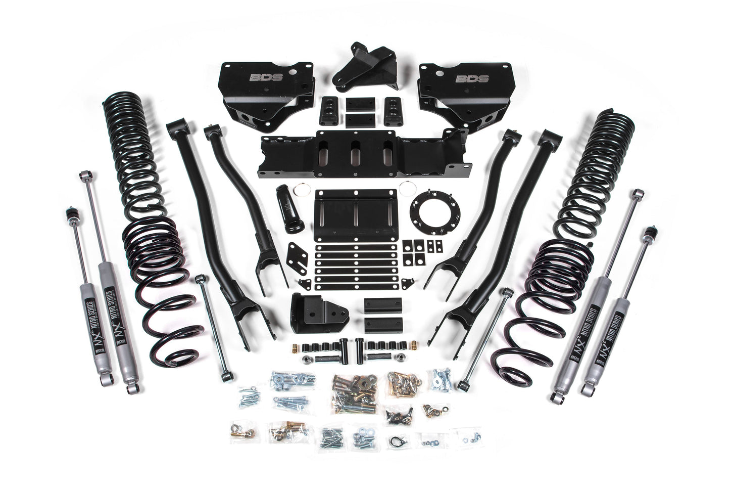 A neatly arranged set of vehicle suspension components, including coil springs, shock absorbers, control arms, mounting brackets, and various nuts, bolts, and hardware for the BDS 4 Inch Lift Kit with 4-Link for RAM 2500 (2019-2024) Diesel models. The black and metallic parts are displayed on a white background.