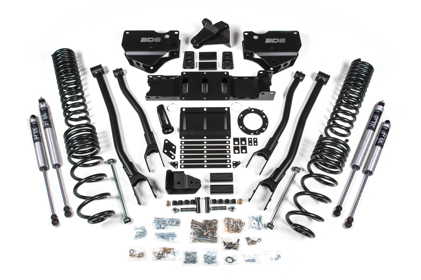 A complete 6-inch BDS lift kit with 4-link for the RAM 2500 (2019-2024) 4WD diesel displayed in an organized manner against a white background. It includes Pro-Ride coil springs, shock absorbers, control arms, brackets, and various bolts and hardware components arranged symmetrically.