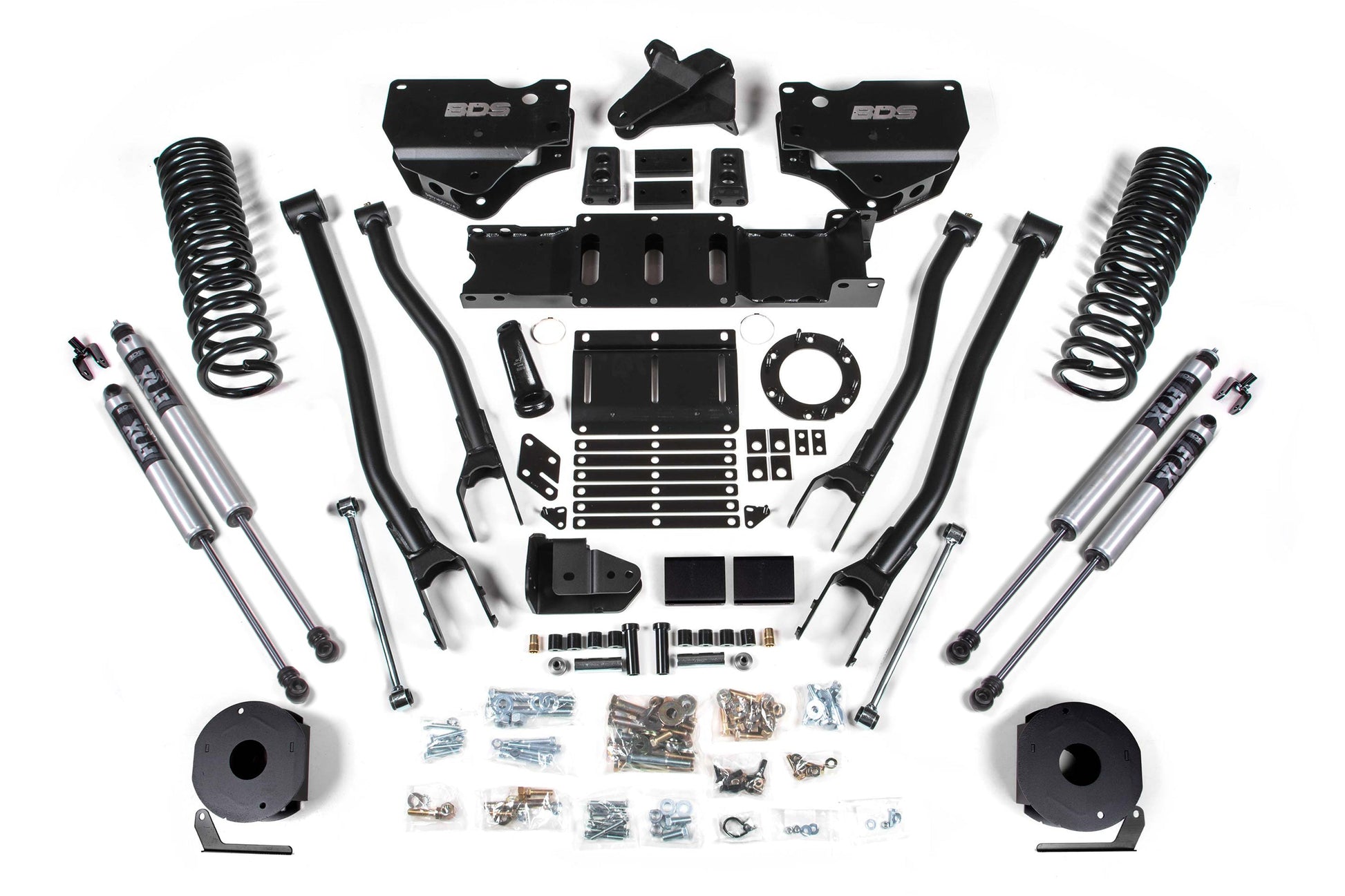 An arranged display of various vehicle suspension components, including coil springs, shock absorbers, brackets, arms, and assorted hardware. The parts are laid out in an organized manner on a plain white background, showcasing a BDS 5.5 Inch Lift Kit with 4-Link for the Ram 2500 with Rear Air Ride (model years 2019-2024) 4WD Gas.