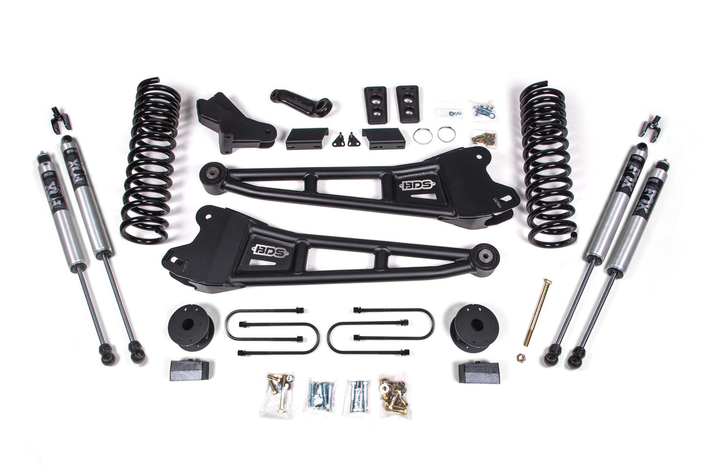 Image of a 4 Inch Lift Kit with Radius Arm for a Ram 3500 (2013-2018) with Rear Air Ride, neatly laid out. The BDS Suspension kit features two upper control arms labeled "BDS," Pro-Ride coil springs, shock absorbers, U-bolts, and various small parts and hardware pieces such as bolts, nuts, and spacers.