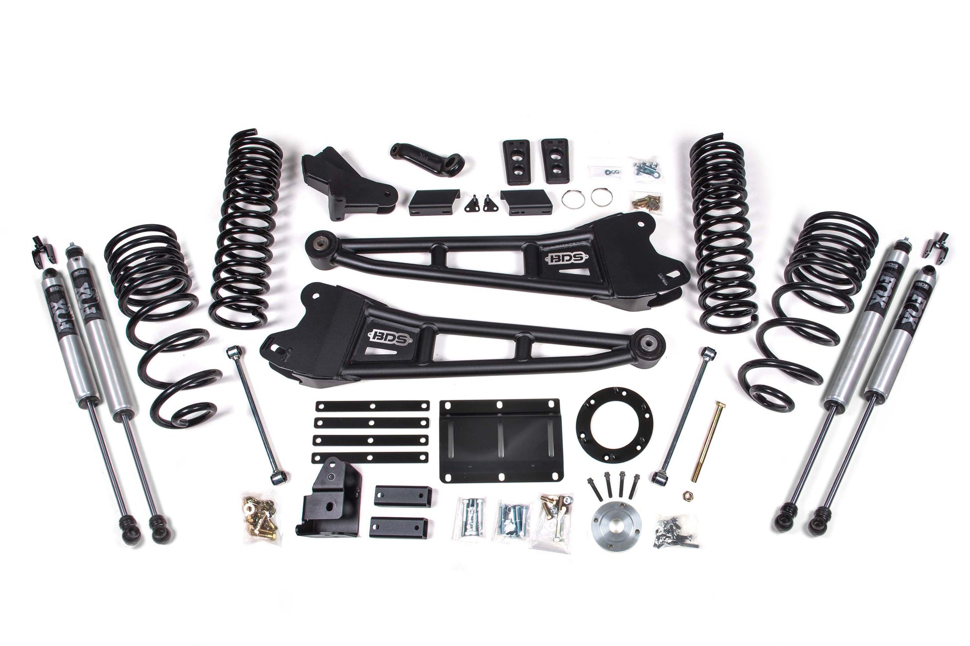 The 5.5 Inch Lift Kit W/ Radius Arm for Ram 2500 (14-18) 4WD | Gas by BDS includes assorted vehicle suspension components, featuring two black control arms with "BDS" logos, four Pro-Ride coil springs, four FOX 2.0 Performance shocks, and various brackets, bolts, and hardware, all neatly arranged on a white background.