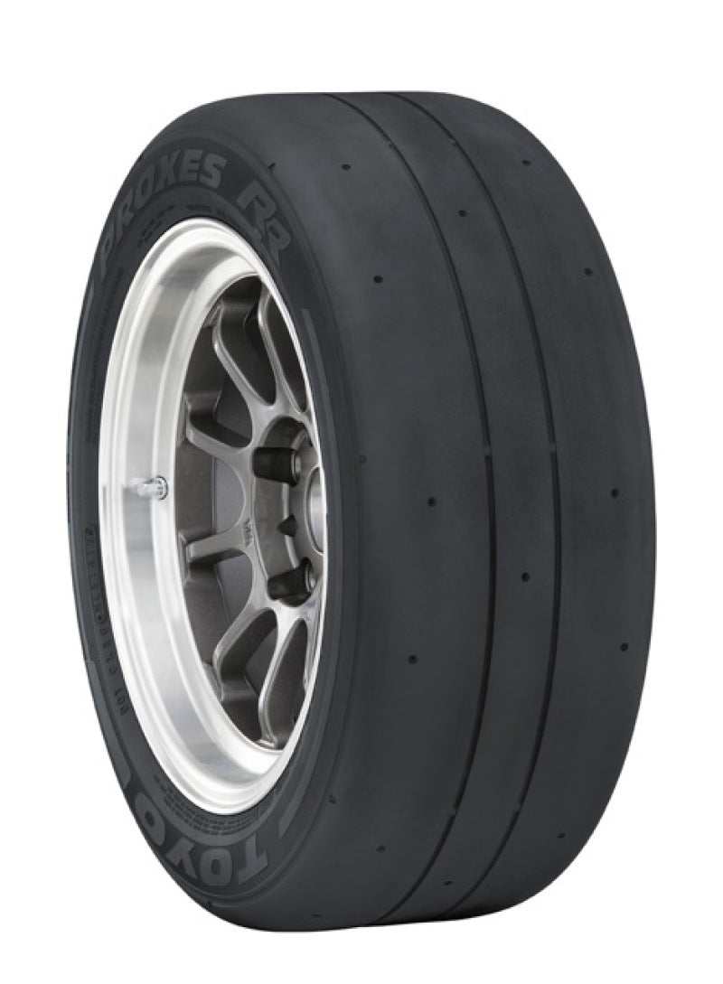 The Toyo Proxes RR tire (325/30ZR20, 102Y) features a smooth tread on a sleek alloy wheel. "Proxes RR" and "Toyo" are branded on the sidewall, engineered for race track traction and speed.