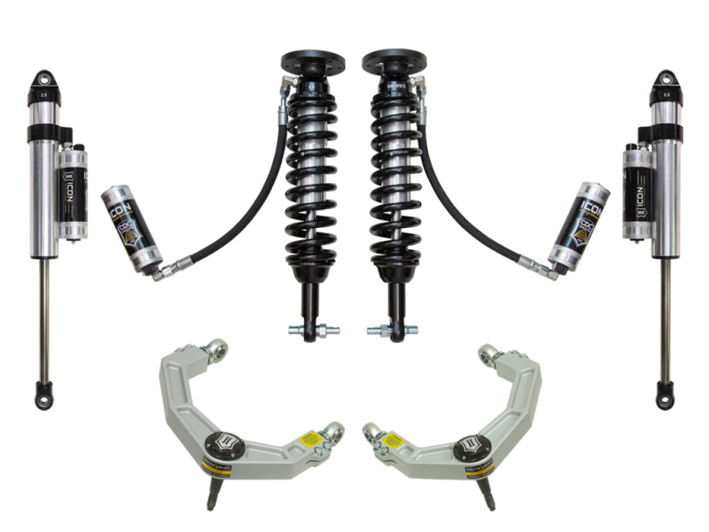 The ICON 2014 Ford F-150 4WD 1.75-2.63in Stage 5 Suspension System with Billet Upper Control Arm (UCA) includes off-road suspension components such as two coilovers, two shock absorbers, and two upper control arms featuring Delta Joint technology, all designed for vehicle modification.