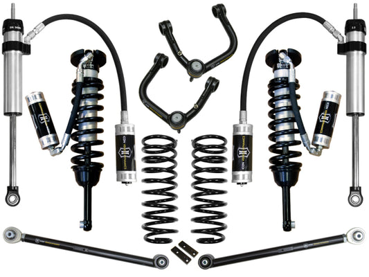 A detailed arrangement of the ICON 03-09 Toyota 4Runner/FJ 0-3.5in Stage 5 Suspension System w/Tubular Uca, showcasing corrosion-resistant shock absorbers, Delta Joint upper control arms, coil springs, and connecting rods from ICON, displayed against a white background.