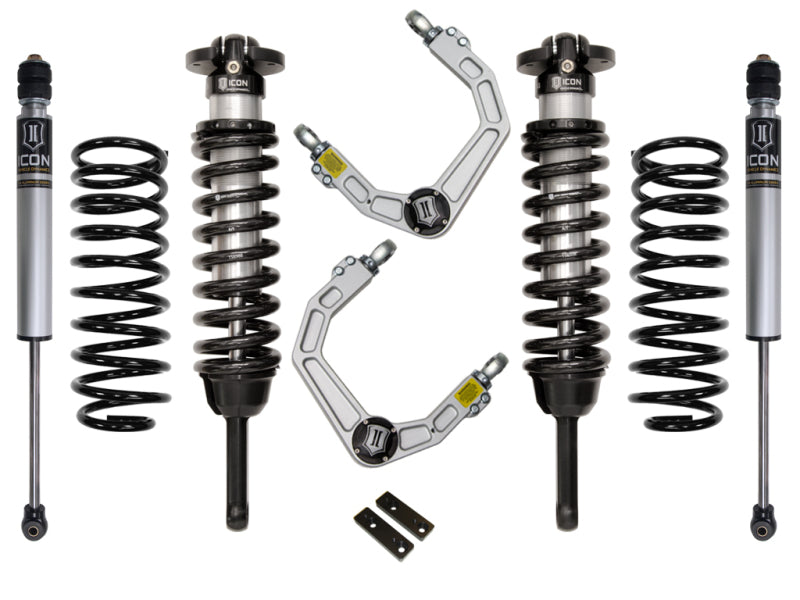 The ICON 03-09 Toyota 4Runner/FJ 0-3.5in Stage 2 Suspension System w/Billet UCA by ICON is displayed on a white background, showcasing two coilover shocks, two springs, upper control arms featuring a heavy-duty ball joint, and two brackets.