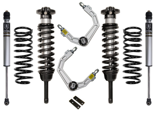 The ICON 03-09 Toyota 4Runner/FJ 0-3.5in Stage 2 Suspension System w/Billet UCA by ICON is displayed on a white background, showcasing two coilover shocks, two springs, upper control arms featuring a heavy-duty ball joint, and two brackets.