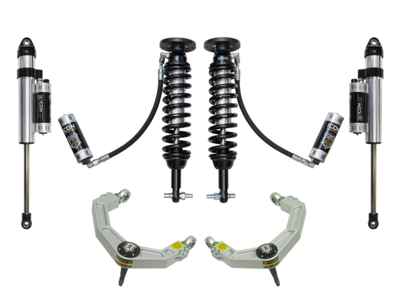 The ICON 2014 Ford F-150 2WD 1.75-2.63in Stage 5 Suspension System features two coilover shock absorbers with black springs, external reservoirs connected by hoses, and sturdy billet upper control arms with a Delta Joint, symmetrically arranged against a white background.