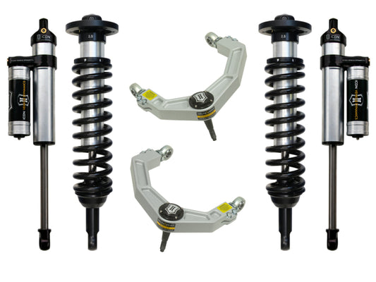 The image displays the ICON 04-08 Ford F-150 2WD Stage 3 Suspension System, featuring four shock absorbers with coil springs and two billet upper control arms equipped with Delta Joint technology for improved performance. The components are set against a white background, highlighting their design, corrosion resistance, and structural integrity.