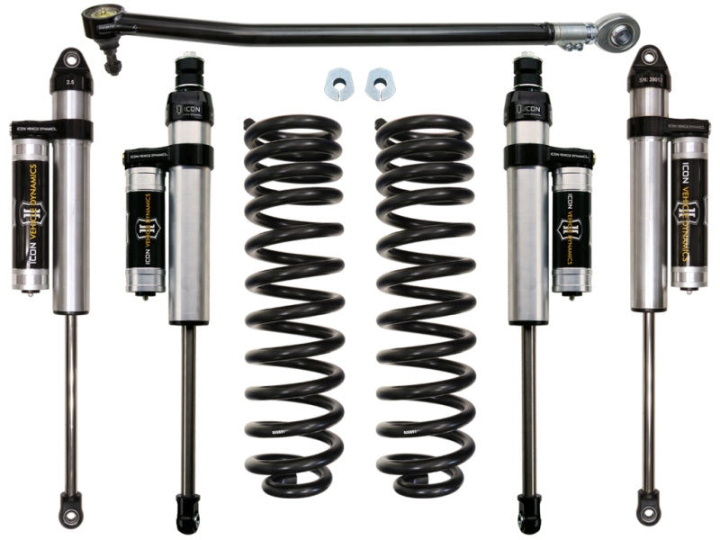 Image of the ICON 2017+ Ford F-250/F-350 2.5in Stage 3 Suspension System by ICON, showcasing four shock absorbers, two coil springs, an adjustable track bar, and two additional components. The parts are arranged in an orderly fashion against a plain white background.