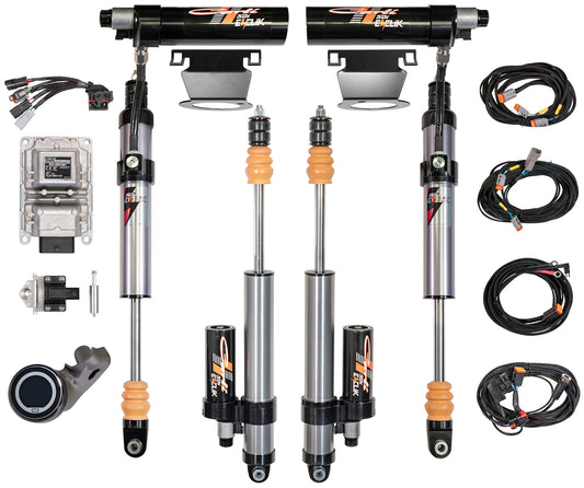 The Carli Suspension 14-23 Ram 2500 (4WD - Coil/Coil) DIESEL EVENTURE 2.5" Remote Res Shock Set with a 3.25" lift is elegantly showcased against a white background, featuring four electronically controlled shocks, an array of cables, a control module, a mount, and additional hardware. Each component is meticulously arranged to complement the main parts.