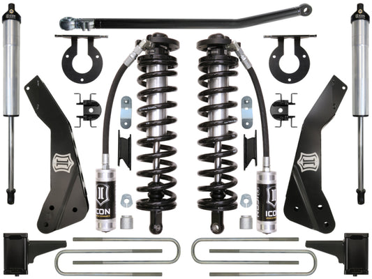 Featured in this display is the ICON 11-16 Ford F-250/F-350 4-5.5in Stage 2 Coilover Conversion System, showcasing coil springs, shock absorbers, brackets, and hardware components. The parts are symmetrically arranged against a white background to highlight the metal and rubber elements specifically designed for Ford Super Duty Suspension with ride height adjustability in mind.