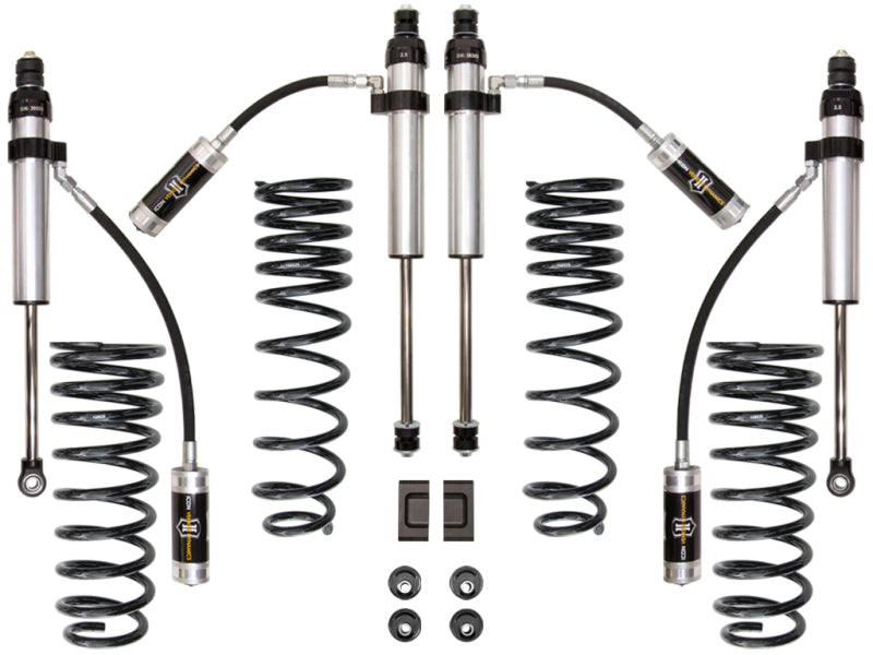 The ICON 91-97 Toyota Land Cruiser 80 Series 3in Stage 2 Suspension System, crafted by ICON, is designed to enhance off-road performance. It includes two pairs of shock absorbers, coiled springs, and additional components arranged symmetrically on a white background. The kit also contains hoses and connectors, making it ideal for your Land Cruiser's suspension needs.