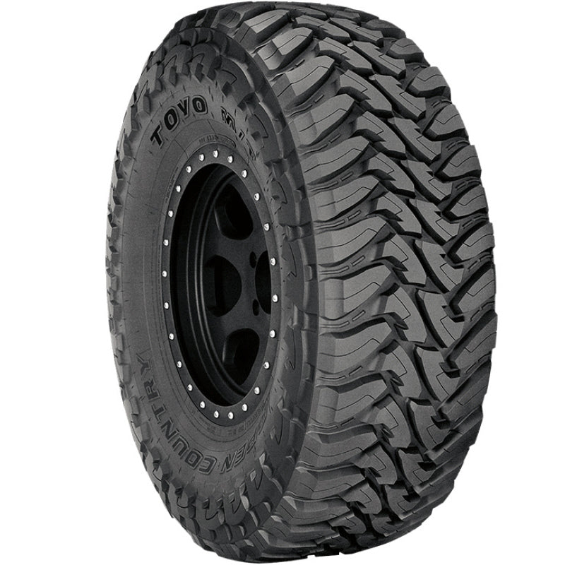 The TOYO Open Country M/T Tire - 40X1350R17 121Q offers deep tread patterns designed to provide exceptional traction on rugged terrains. The sidewall showcases unique branding and detailed model information. Presented against a plain white background, this tire conveys a powerful and reliable presence.