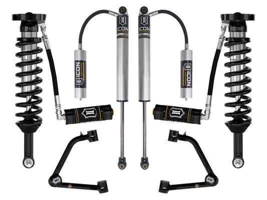 The ICON 2023 Chevrolet Colorado 1.75-2.5in Stage 3 Suspension System w/ Tubular UCA features two shock absorbers with reservoirs, two coil springs, and Delta Joint PRO upper control arms, all showcased on a white background.