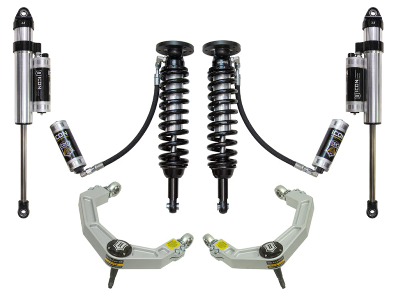 A set of the ICON 09-13 Ford F-150 4WD 1.75-2.63in Stage 5 Suspension System w/Billet Uca, including coilover shocks with attached reservoirs and Delta Joint-equipped upper control arms, all displayed against a white background.