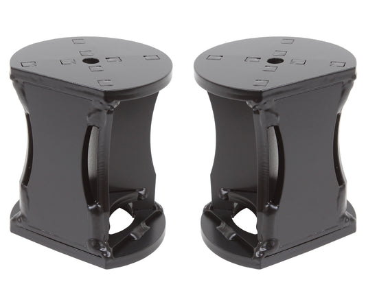 Two black metal front bumpstop drops from Carli Suspension, part of the 17-23 Ford F-250/F-350 (4WD) lift kit, feature a cylindrical design with side openings and a flat top that includes a small central hole. Ideal for achieving a 4.5" lift, they are displayed upright on a white background.