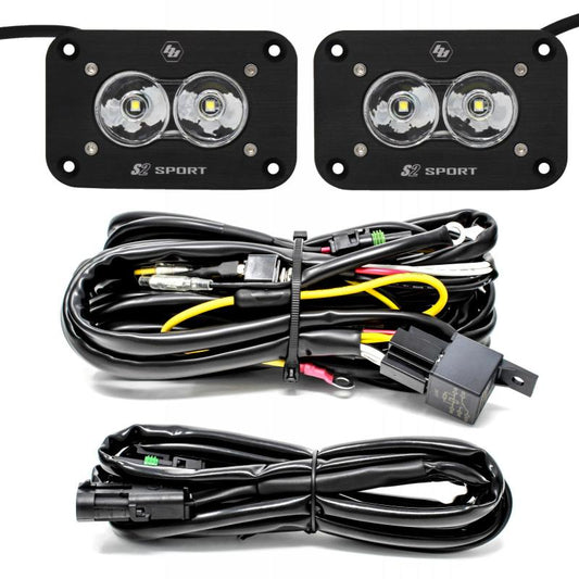 The Baja Designs S2 Sport Flush Mount Work/Scene Pattern LED Work Light - Clear is a set of two rectangular lights featuring two lenses each, complete with neatly arranged coiled wires and connectors for easy installation. This lighting kit from Baja Designs is ideal for vehicles or outdoor activities.