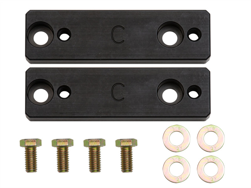 ICON 2015+ Chevrolet Colorado Sway Bar Relocation Kit features black aluminum bearing hangers with counter-bored holes, designed specifically for Chevrolet Colorado. The kit includes four bolts and four washers.