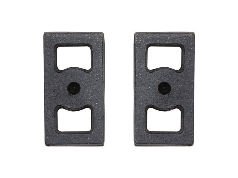 The ICON 1in Cast Block Kit (3in Wide) by ICON consists of a pair of 1" blocks, each featuring two cut-out rectangular sections and a central circular hole. They are positioned side by side against a white background.