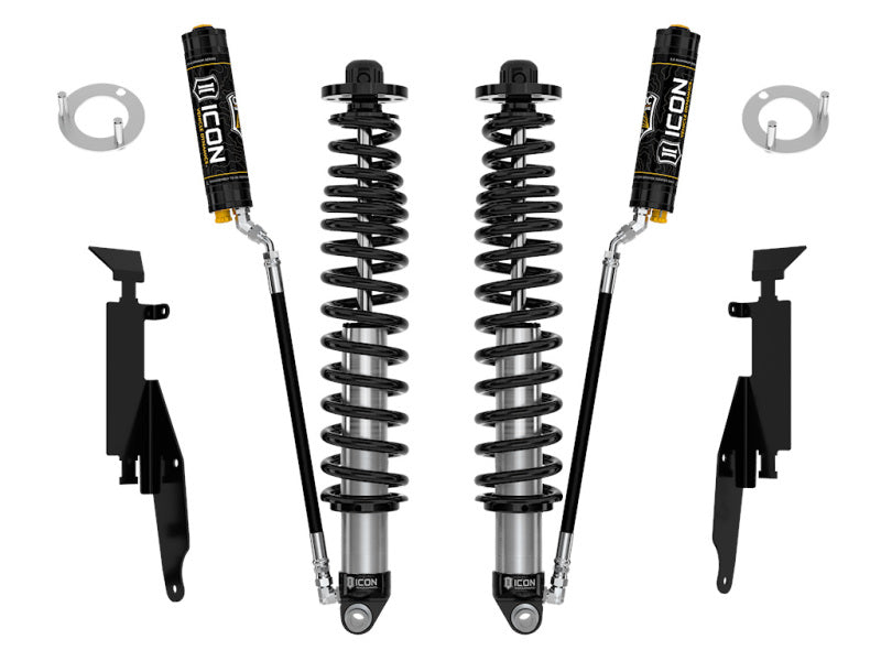 Image displaying a set of automotive suspension components from ICON, featuring the ICON 21-UP Ford Bronco 2-3in Rear 2.5 VS RR CDCV Coilover Kit, complete with two rear coilover shocks, mounting brackets, and additional hardware for Ford Bronco installation. The items are arranged on a white background.